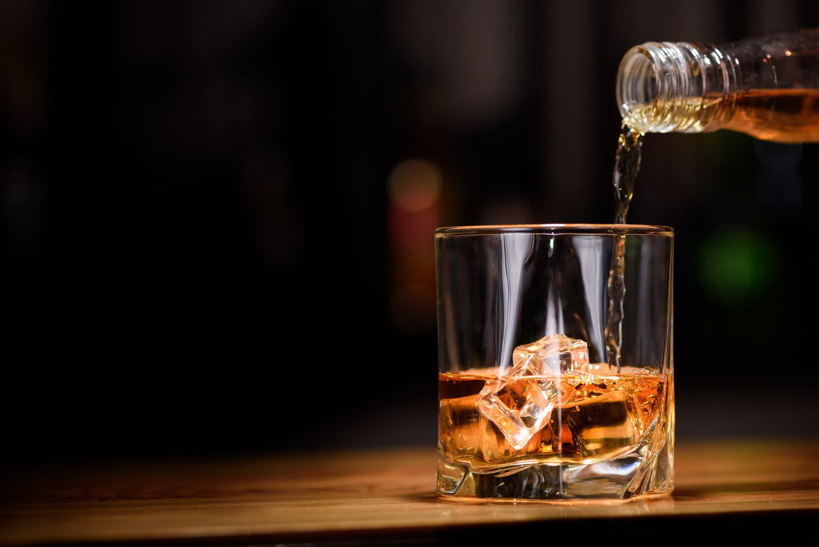 Still life. pour or whiskey in to glass